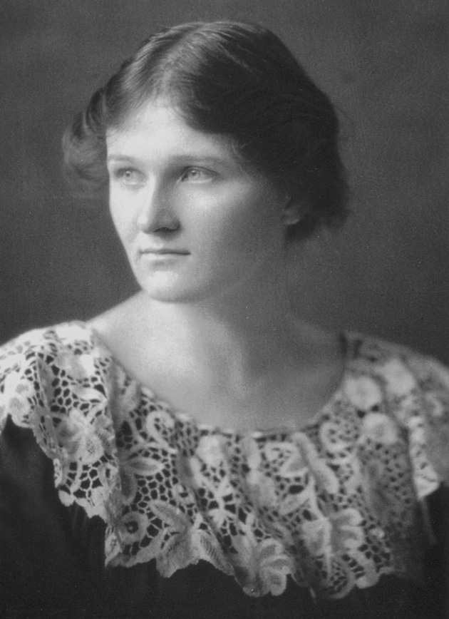 A black-and-white photo of a young woman with a crocheted collar, Cecilia Payne, gazing away from the camera to left.